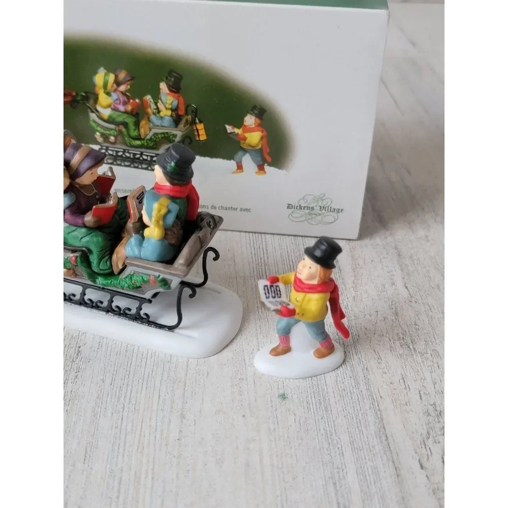 Dept 56 58396 Caroling With The Cratchit Family (Revisited) village accessory xm